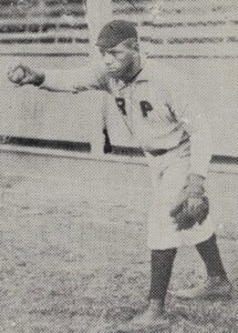 Photo of Negro Leagues baseball player Emmett Bowman in uniform warming up